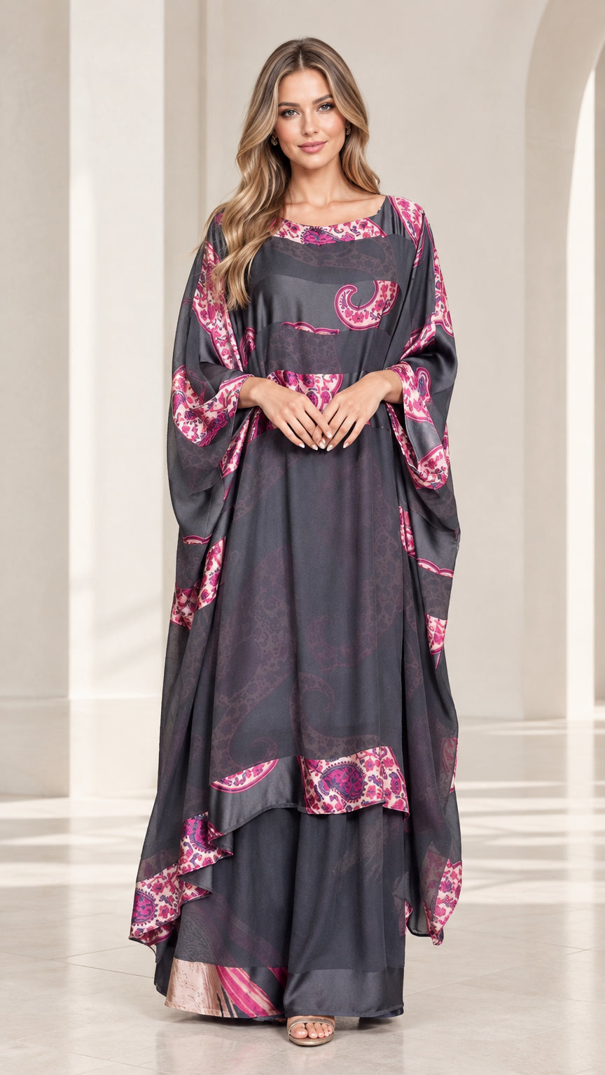 Full front view of model wearing charcoal grey paisley trim draped kaftan maxi dress