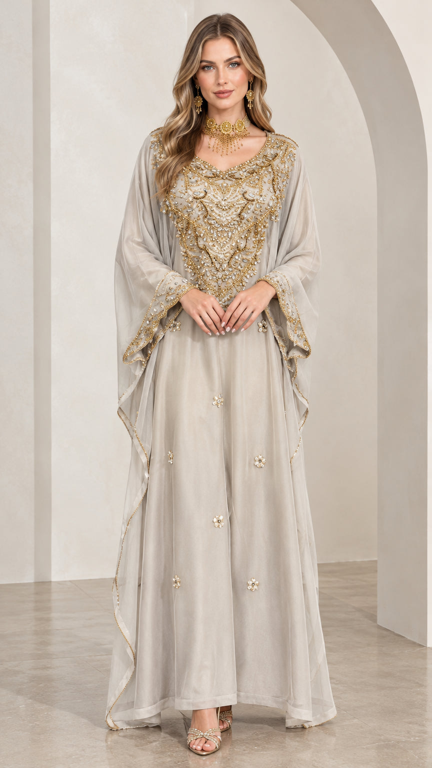 Front full-length view of woman wearing silver grey embroidered kaftan maxi dress