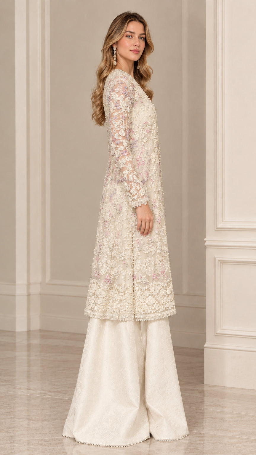 Side view of woman posing in cream floral lace long tunic and matching palazzo pants