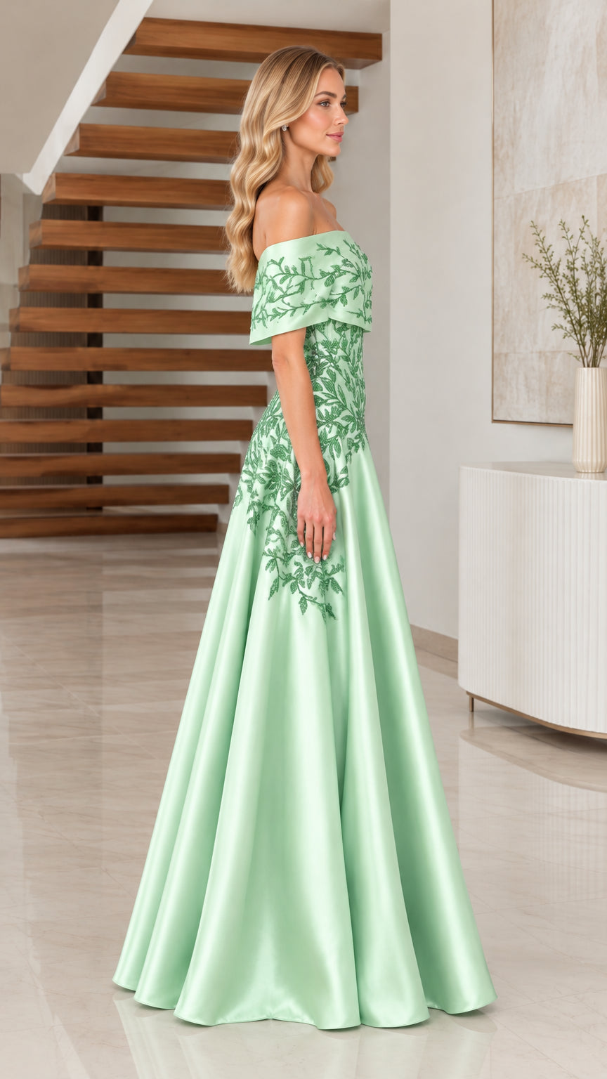 Side profile of model wearing Sage Green satin formal gown with beaded bodice