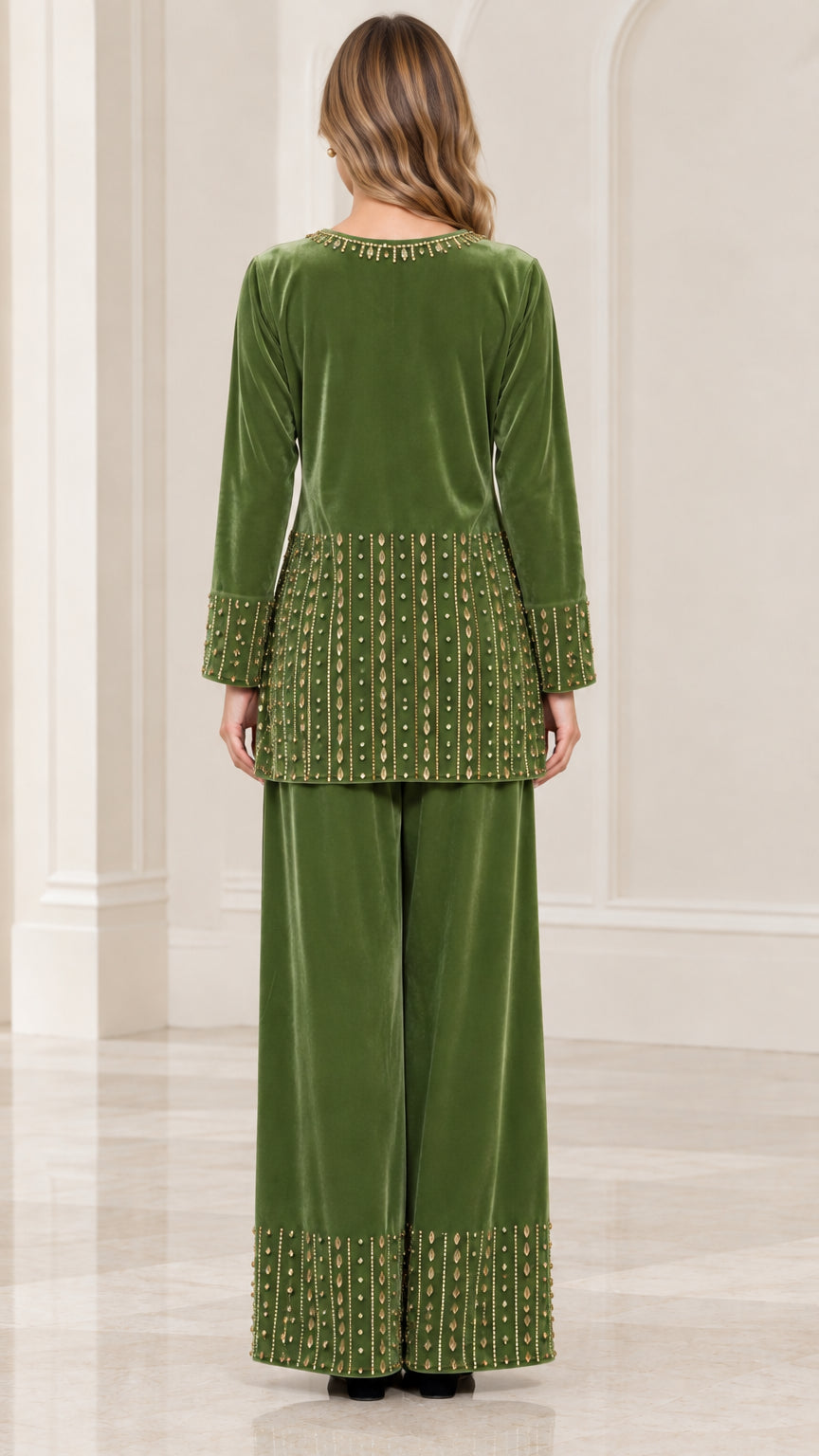 Back view of woman wearing olive green velvet tunic top and wide-leg trousers