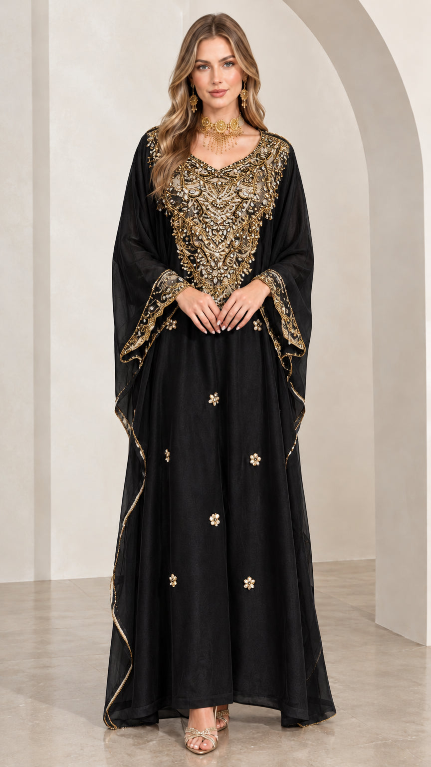 Woman wearing classic black kaftan maxi dress with gold metallic embroidery