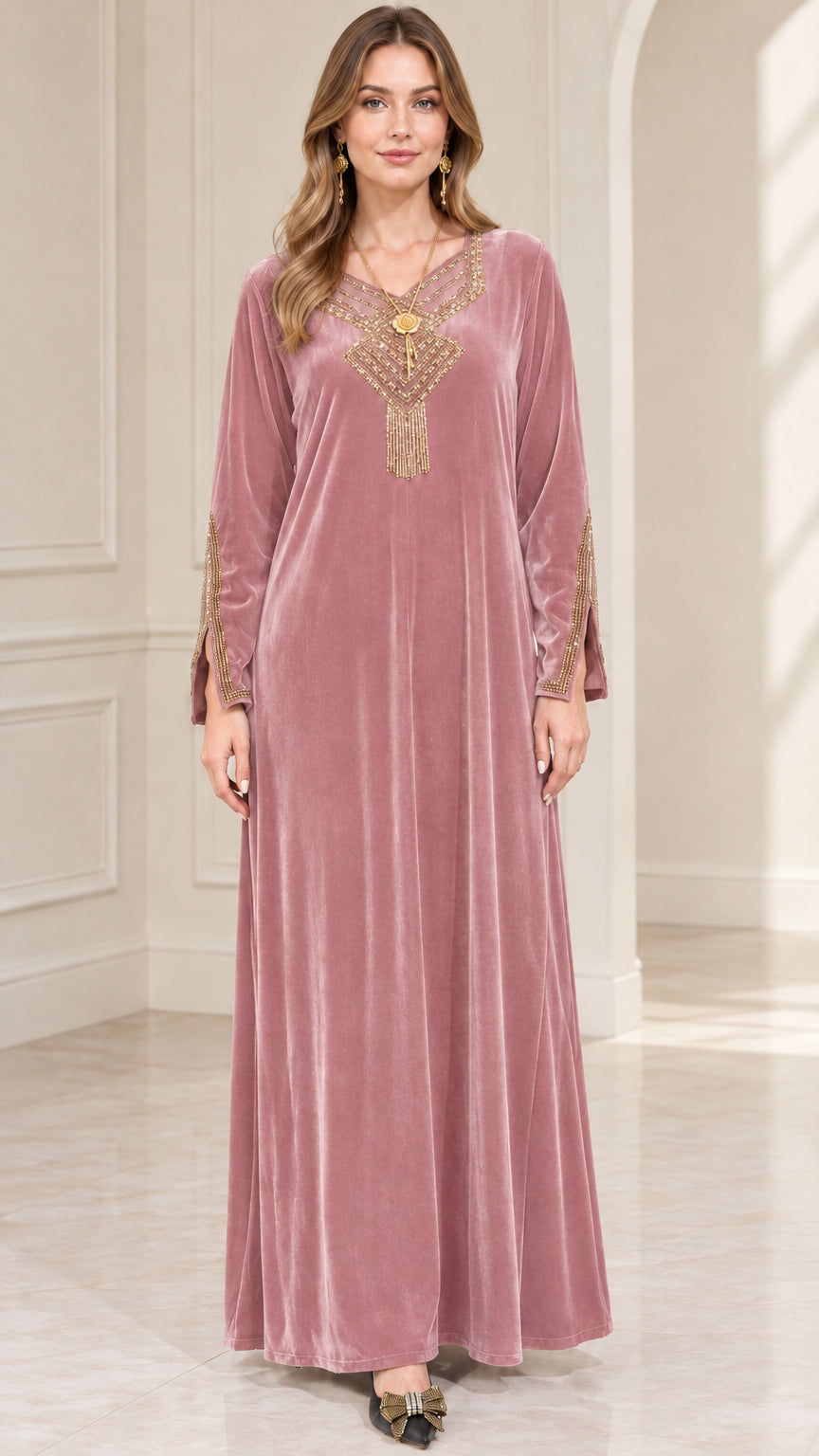 Front view of woman wearing dusty pink embroidered velvet maxi dress