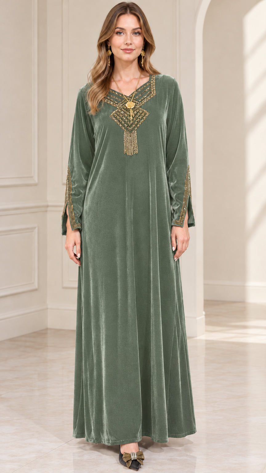 Front view of woman wearing sage green embroidered velvet maxi dress
