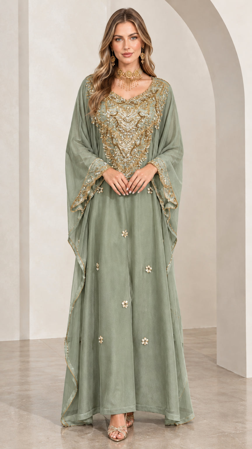 Woman wearing sage green embroidered kaftan maxi gown