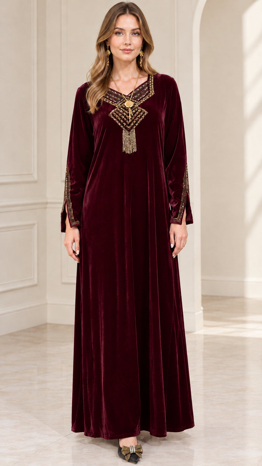 Front view of woman wearing burgundy wine red embroidered velvet maxi dress