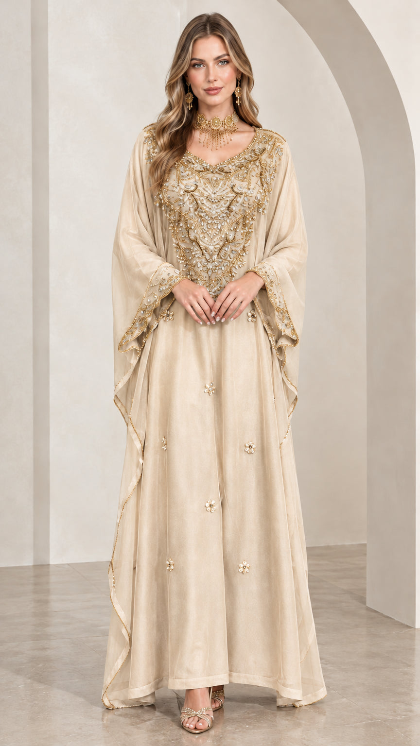 Woman wearing champagne beige beaded kaftan maxi dress